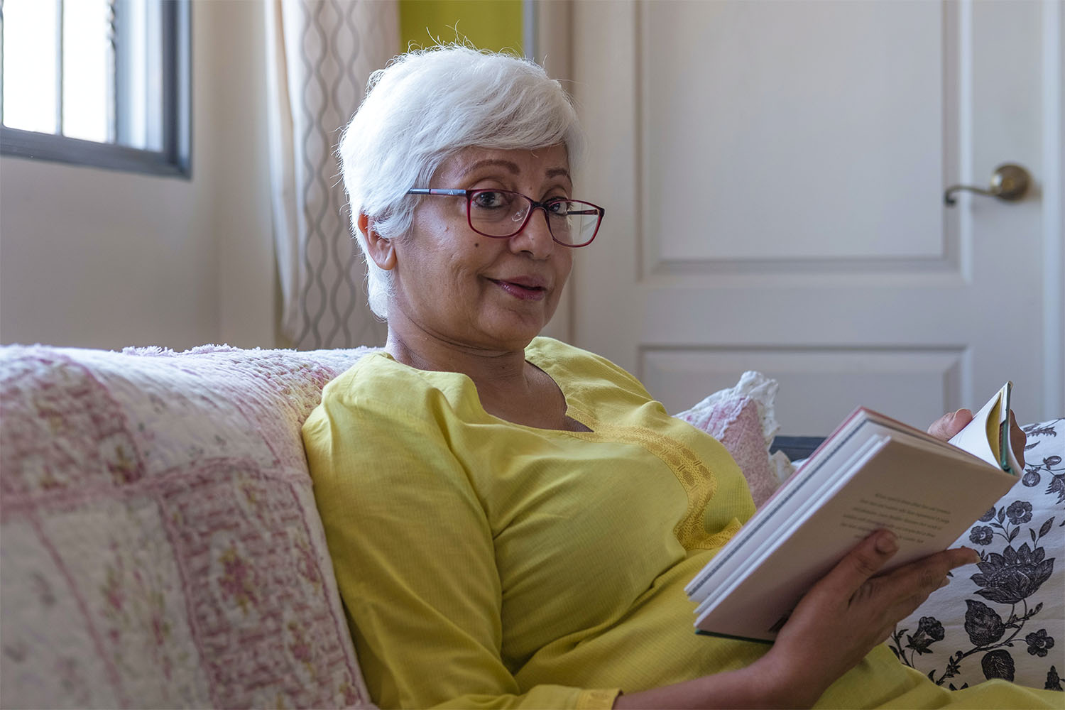 woman reading a book in respite care